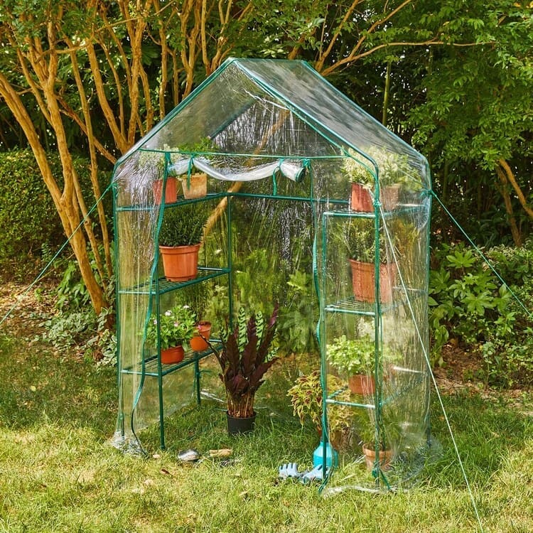portable greenhouse in a garden